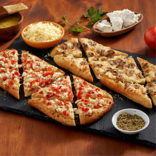 Limited time new flatbreads made with our Authentic ItalianBread Crust. Two new recipes: Feta Bruschetta or Balsamic marinated Mushroom. $9.95 each for a limited time.